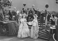 Cheering accompanies the completion of the Union Pacific Railroad, in Utah; from the original production.