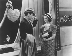 Co-stars George Raft and Sylvia Sidney meet outside a department store, the primary setting for the film.